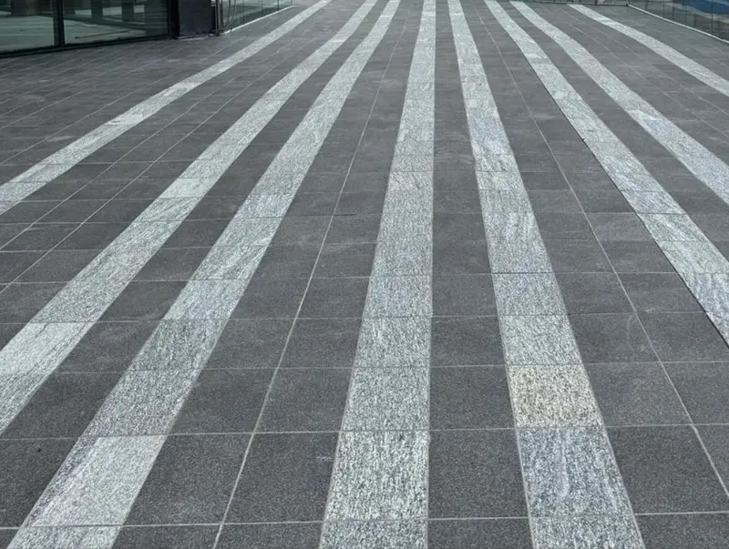 Outdoor paving and tile installation in Vancouver showing patio, walkway, and pool deck weatherproofing
